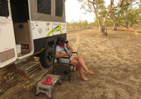 Paula sitting with binoculars