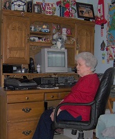 lady ham radio operator at her radio station